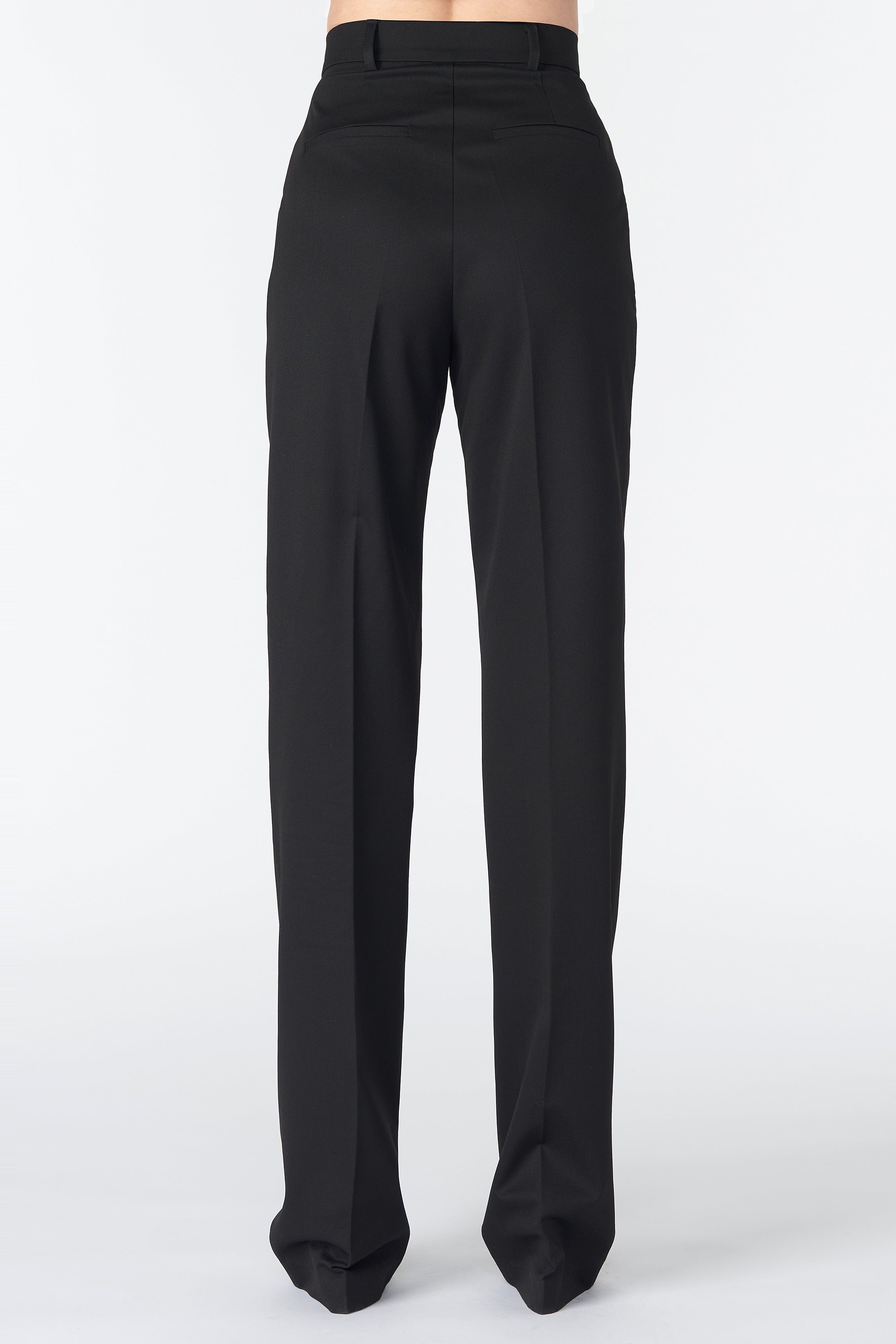 Back view of Corja Black suit pants showing tailored fit and sleek design on a neutral background.